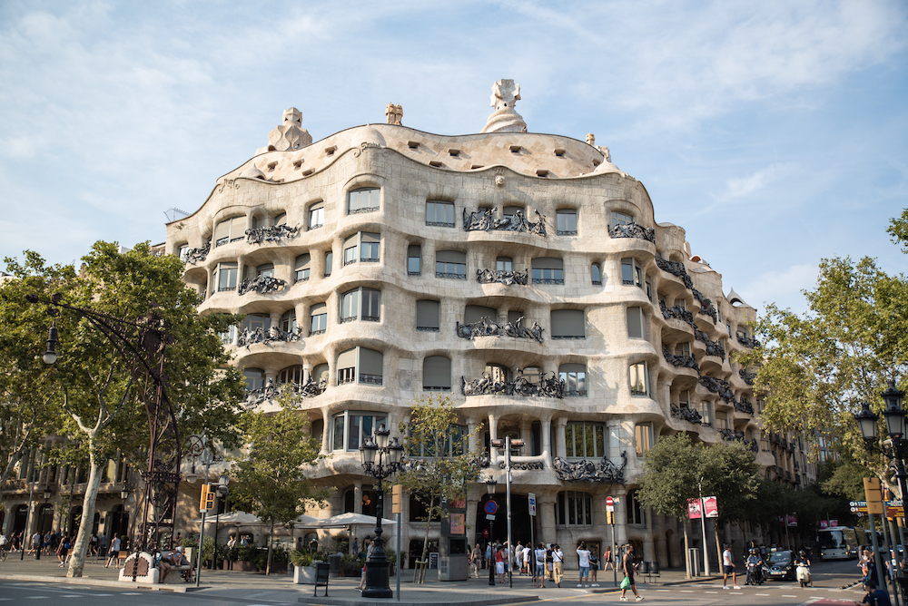 BARCELONA, SPAIN - OCTOBER 7, 2021: People Visit Passeig De Gracia Street  In Eixample District, Barcelona, Spain. Passeig De Gracia Is Famous For Its  Modernist Architecture And High Street Fashion Shopping. Stock